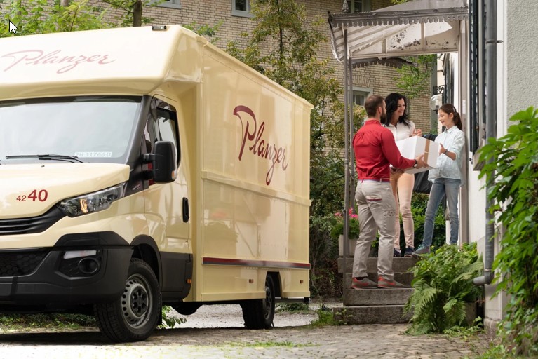 Planzer delivery vehicle delivering parcels to a customer in Switzerland
